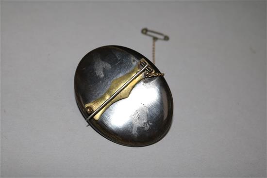 A horn mounted carved ivory cameo brooch, 2in.